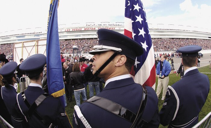 Nellis Air Force Base Elite Honor Guard members prepare to present the colors prior to the start of the UAW-Daimler Chrysler 400 Nextel Cup race March 12, 2006, at the Las Vegas Motor Speedway. (U.S. Air Force photo/Master Sgt. Kevin J. Gruenwald)


