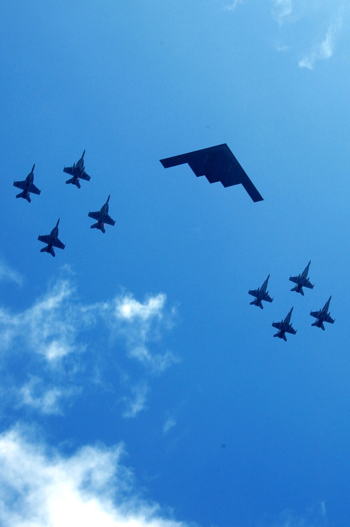 A B-2 Spirit leads other aircraft from the Air Force, Navy and Marine Corps as they fly over the western Pacific Ocean on Sunday, June 18, to kick off Exercise Valiant Shield 2006. The joint exercise consists of 28 naval vessels, more than 300 aircraft and approximately 20,000 servicemembers. (U.S. Navy photo/Photographer's Mate Airman Benjamin Dennis)