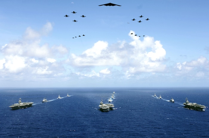 A B-2 Spirit and 16 other aircraft from the Air Force, Navy and Marine Corps fly over the USS Kitty Hawk, USS Ronald Reagan and USS Abraham Lincoln carrier strike groups in the western Pacific Ocean on Sunday, June 18, to kick off Exercise Valiant Shield 2006. The joint exercise consists of 28 naval vessels, more than 300 aircraft and approximately 20,000 servicemembers. (DOD photo/Photographer's Mate 3rd Class Jarod Hodge)