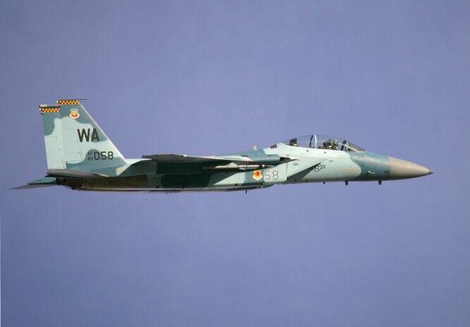 An F-15 shows off its new Aggressor paint scheme over Nellis Air Force Base, Nev. The 65th Aggressor Squadron, which flies the F-15, stood up earlier this year. The 64th Aggressor Squadron, also at Nellis, flies F-16 Aggressor aircraft. Both squadrons prepare combat air force joint and allied aircrews for tomorrow’s victories through challenging, realistic threat replication, training, test support, academics and feedback. (Photo courtesy Paul Ridgway, Typhire Photography)