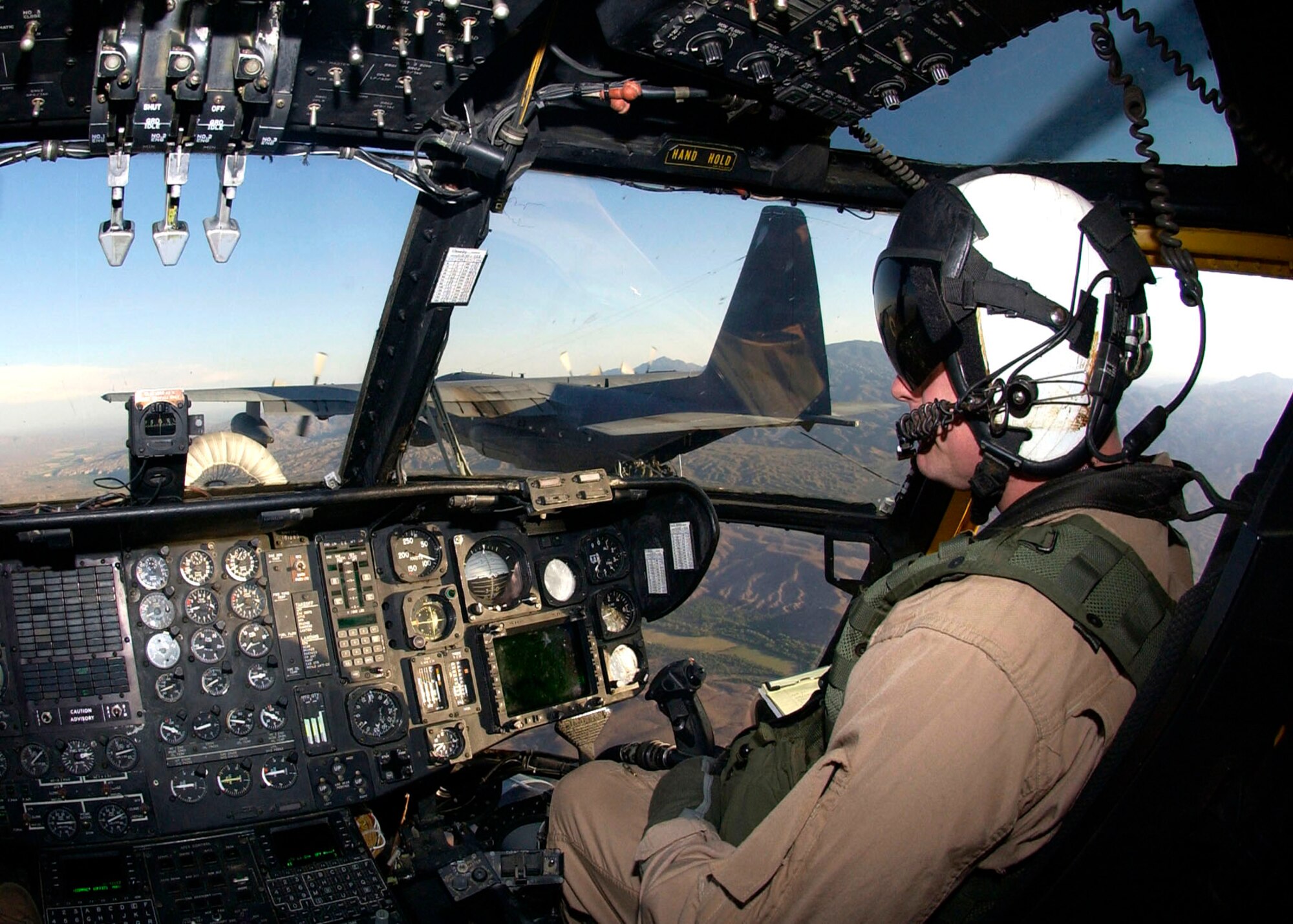 Marine Maj. David Montesano guides a CH-53E Super Stallion helicopter while gaining fuel from an HC-130 from the 79th Rescue Squadron at Davis-Monthan Air Force Base, Ariz. The CH-53E and Major Montesano are assigned to the Marine Heavy Helicopter Squadron 769 at Edwards Air Force Base, Calif. The CH-53Es are here training with Airmen as part of Davis-Monthan's joint operations training. (U.S. Air Force photo/Airman 1st Class Veronica Pierce)