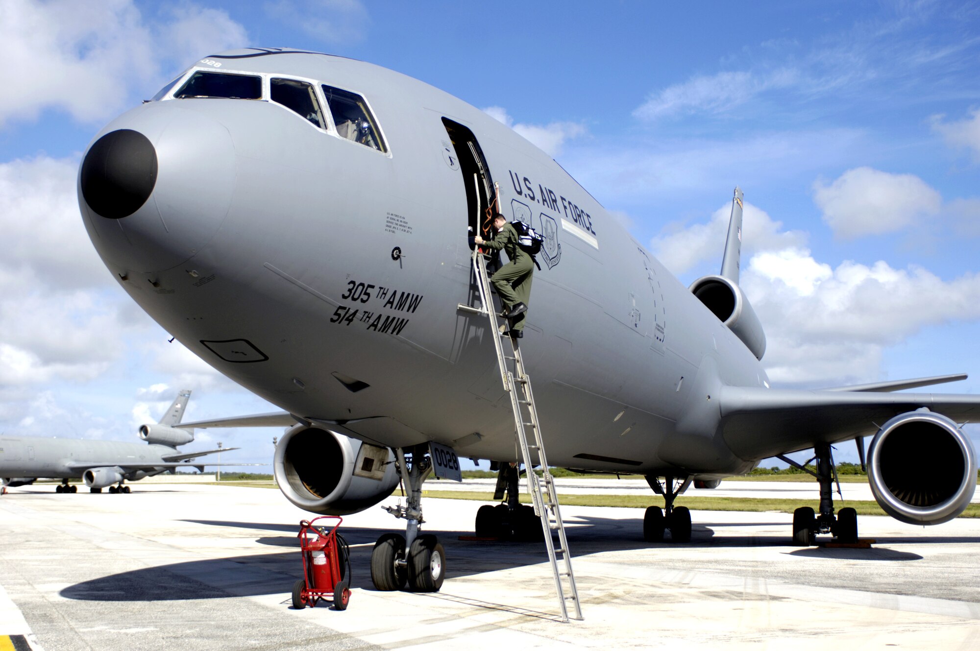 Staff Sgt. Michael Hinton climbs into a KC-10 Extender at Andersen Air Force Base, Guam, on Wednesday, June 21, during Exercise Valiant Shield. The joint exercise includes more than 300 aircraft, 28 naval vessels and approximately 20,000 service members. Sergeant Hinton is a boom operator with the 9th Air Refueling Squadron at Travis AFB, Calif. (U.S. Air Force photo/Tech. Sgt. Shane A. Cuomo) 