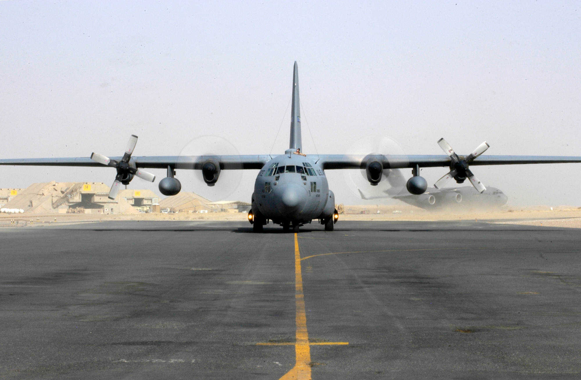 A C-130 Hercules from the 386th Air Expeditionary Wing prepares to taxi out for takeoff at a deployed location in Southwest Asia on Tuesday, June 20. (U.S. Air Force photo/Staff Sgt. Ryan Hansen) 
