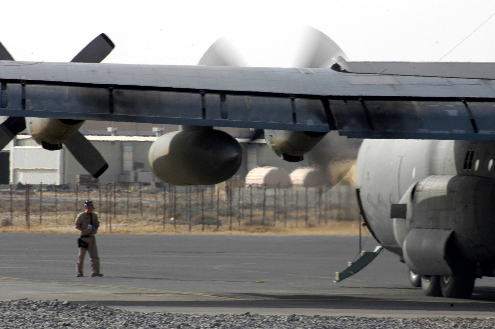 Aircrew and maintainers go over final pre-flight checks on a C-130 Hercules before a mission at a deployed location in Southwest Asia on Tuesday, June 20. The Airmen are with the 386th Air Expeditionary Wing. (U.S. Air Force photo/Staff Sgt. Ryan Hansen) 
