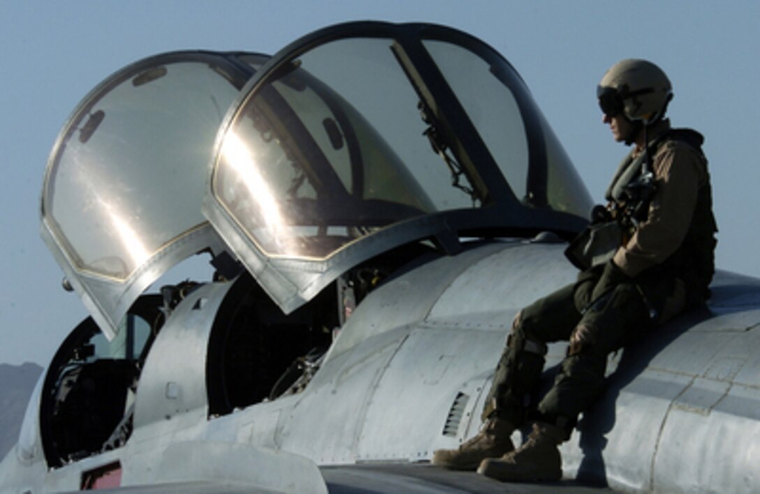 U.S. Air Force Capt. Matthew Polus sits on a U.S. Navy EA-6B Prowler aircraft before taking off from Bagram Airfield, Afghanistan, on June 15, 2006. Polus is an electronic countermeasures officer with Attack Squadron 133. 