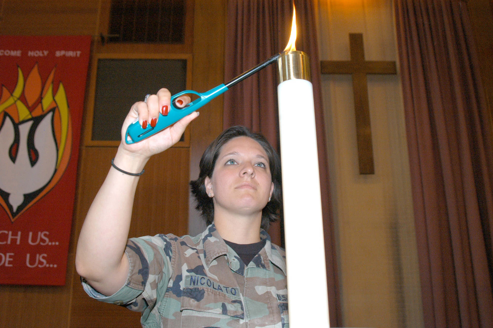 Senior Airman Crystal Nicolato, 7th Bomb Wing chaplain?s assistant, preps an altar for a service. Airman Nicolato is responsiblefor assisting the chaplain?s office mission, to support Airmen spiritually and morally.                                