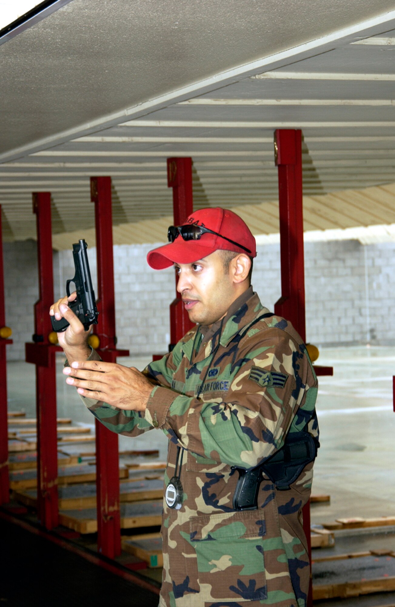 Senior Airman Eric J. Pena, an Air Force Reserve combat arms instructor at the 349th Air Mobility Wing, Travis Air Force Base, Calif., is one of the Air Force's 12 Outstanding Airmen of the Year for 2006. (U.S. Air Force photo)                               