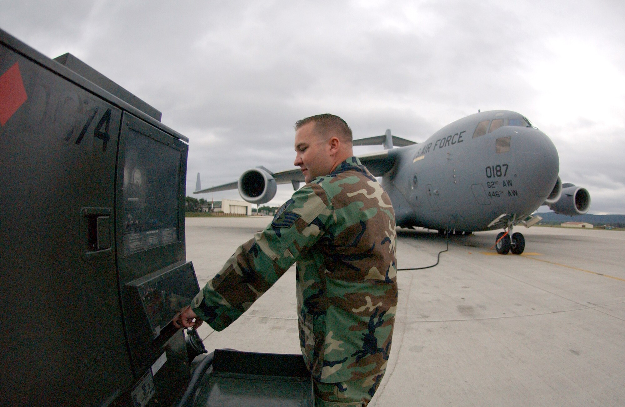 Staff Sgt. Steve Fields powers down the Hobart electrical power cart in order to perform daily maintenance on a C-17 Globemaster III at Ramstein Air Base, Germany on June 22.  Sergeant Fields is a propulsion specialist with the 723rd Air Mobility Squadron. (U.S. Air Force photo/Staff Sgt. Christina M. Rumsey)