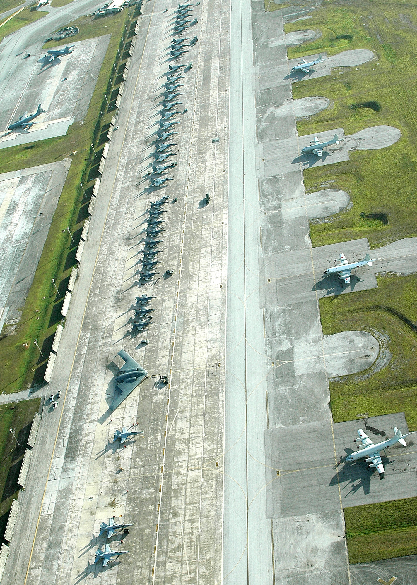 A B-2 Spirit, F-15 Eagles, F-16 Fighting Falcons, F-18 Hornets and Japanense P-3 Orions line the flightline at Andersen Air Force Base, Guam, for Exercise Valiant Shield on Thursday, June 22. The exercise, which concludes June 23, focuses on integrated joint training in a variety of mission scenarios. (U.S. Navy photo/Petty Officer 2nd Class John F. Looney) 

