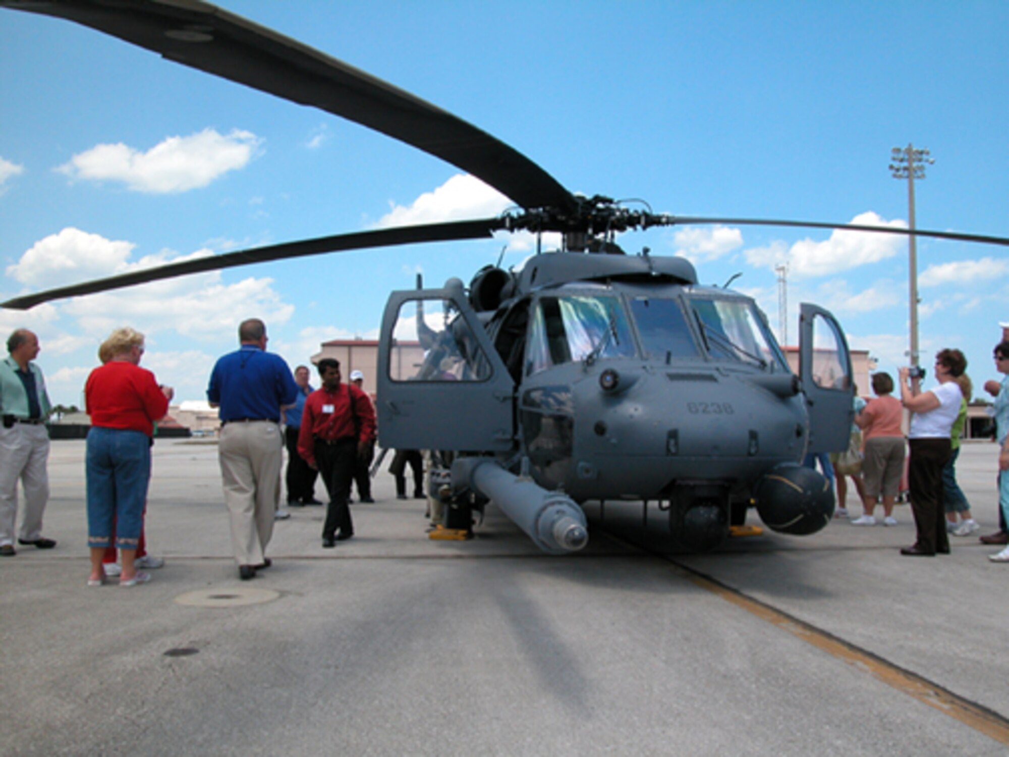 GRISSOM AIR RESERVE BASE, Ind-- A rescue helicopter on display at Patrick AFB, Fla., draws a crowd of Indiana civic leaders during a recent civic leader trip. Those touring had an opportunity to learn about the rescue mission at Patrick, and also toured Cape Canaveral and the USS John F. Kennedy aircraft carrier at Naval Station Mayport, Fla.  ( U.S. Air Force photo/Senior Airman Chris Bolen)