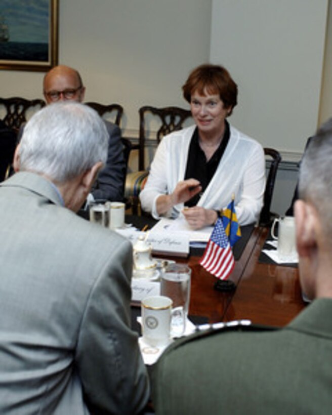 Swedish Minister of Defense Leni Bjorklund meets with Deputy Secretary of Defense Gordon England (left foreground) in the Pentagon on June 20, 2006. England and Bjorklund are meeting to discuss defense issues of mutual interest. 
