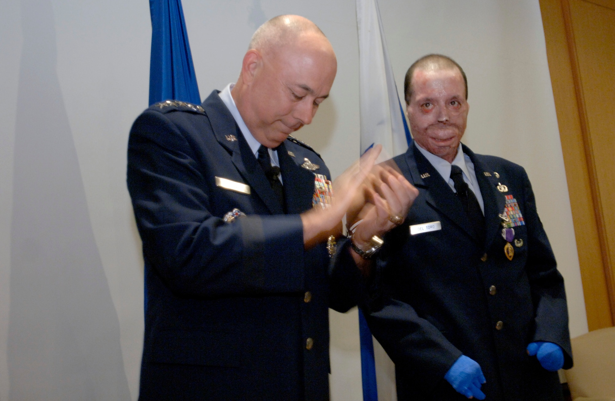 Air Force Chief of Staff Gen. T. Michael Moseley joins the more than 200 family, friends, and fellow servicemembers in applause for Staff Sgt. Israel del Toro during the presentation of the Purple Heart Medal today at Brooke Army Medical Center at Fort Sam Houston, Texas. Sergeant del Toro was wounded during combat action in Afghanistan in December 2005 while supporting Operation Enduring Freedom.  (U. S. Air Force photo/Tech. Sgt. Cecilio M. Ricardo)