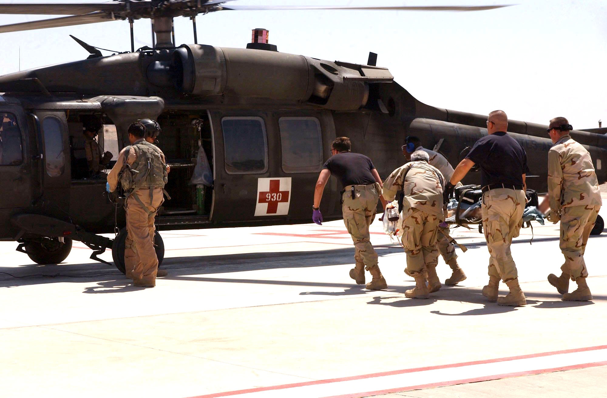 Airmen with the 506th Expeditionary Medical Group at Kirkuk Air Base, Iraq, load an injured patient on an Army UH-60 Black Hawk for medical evacuation on Wednesday, June 21. (U.S. Air Force photo/Senior Airman Angelita M. Collins)

