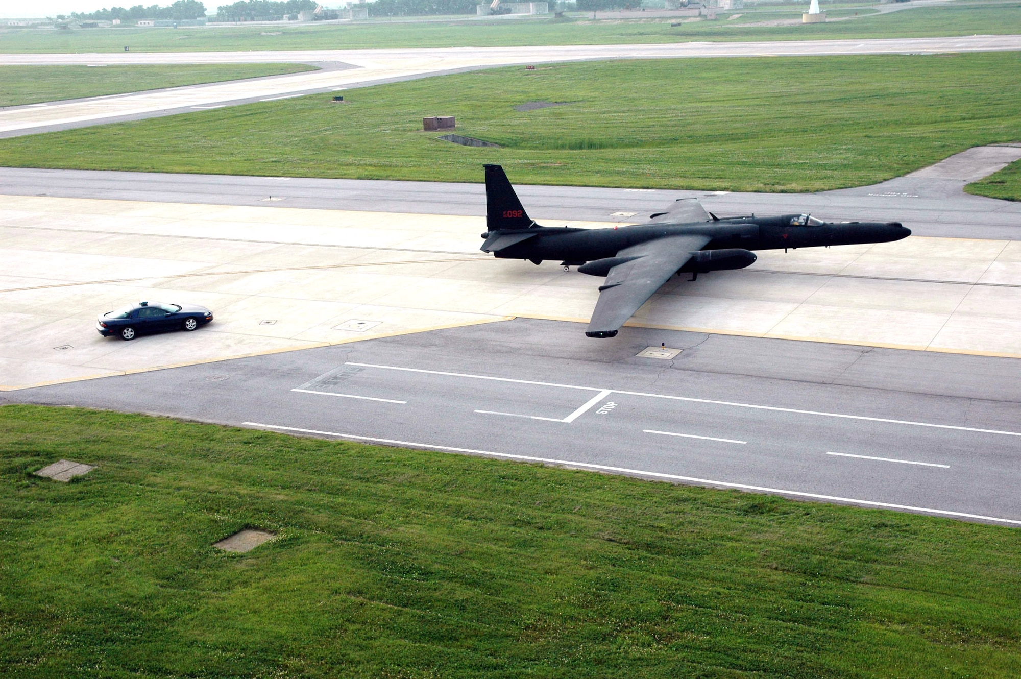 The improved U-2S Dragon Lady, Block 20, aircraft taxis to the runway at Osan Air Base, South Korea, followed by a high-performance chase car. Osan AB was the last forward operating location to receive the new Block 20 aircraft. (U.S. Air Force photo/Staff Sgt. Andrea Knudson) 
