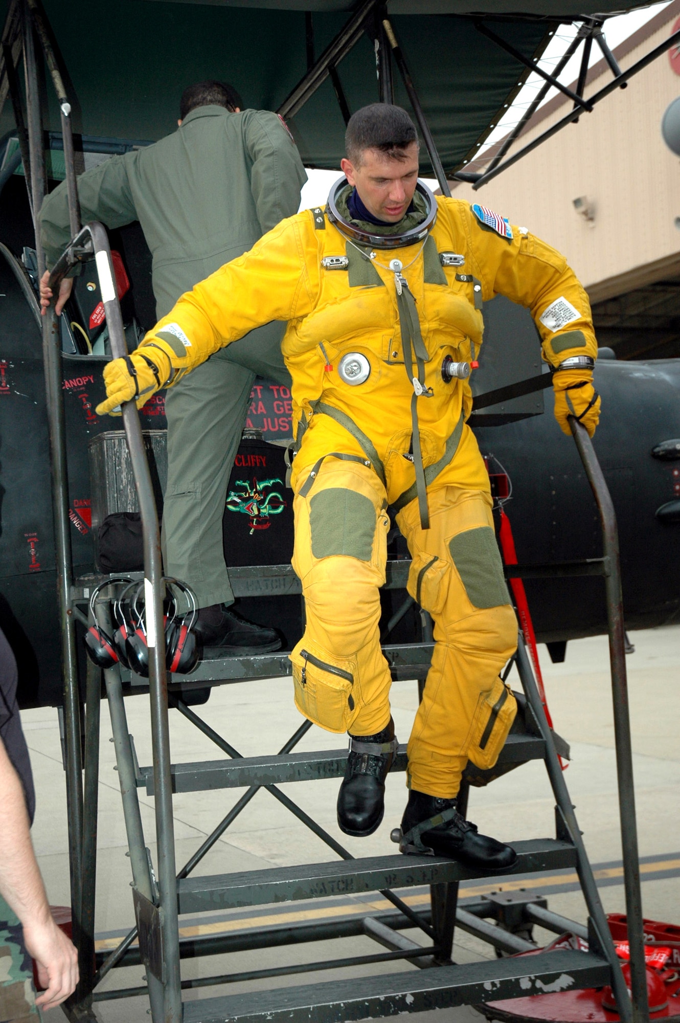 Maj. Michael Clavenna returns to Osan Air Force Base, South Korea, from the last operational reconnaissance flight in the U-2S Dragon Lady, Block 10, aircraft. Major Clavenna is wearing the full pressure suit required for wear by U-2 pilots because of their high-altitude reconnaissance missions. Major Clavenna is the 5th Reconnaissance Squadron assistant director of operations. (U.S. Air Force photo/Staff Sgt. Andrea Knudson) 