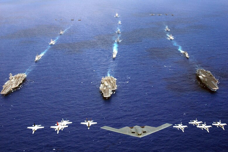 A B-2 Spirit and 16 other aircraft from the Air Force, Navy and Marine Corps fly over the USS Kitty Hawk, USS Ronald Reagan and USS Abraham Lincoln carrier strike groups in the western Pacific Ocean on Sunday, June 18, to kick off Exercise Valiant Shield 2006. (U.S. Navy photo/Chief Photographer's Mate Todd P. Cichonowicz) 