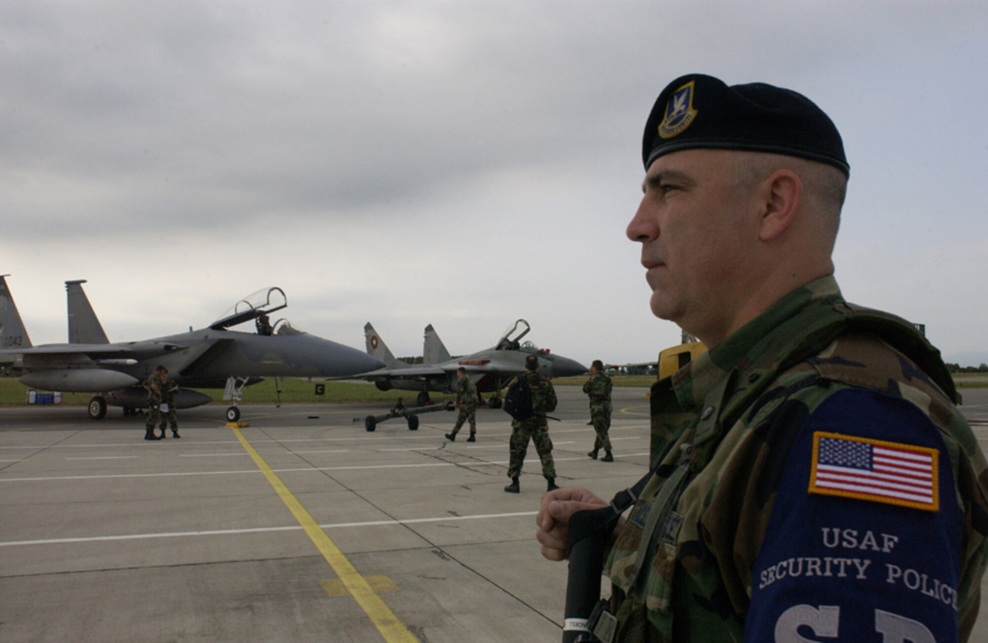 Staff Sgt. James Yandell, 173d Security Forces Squadron, stands watch recently on the flight line at 3d Airbase at Graf Ignatievo, Bulgaria.  More than 100 members of the 173d Fighter Wing, from Kingsley Field, Ore were in Bulgaria for Sentry Lion 2006, a bi-lateral flying exercise with the Bulgarian Air Force.  The two week exercise focused on increasing interoperability with the Bulgarian Air Force.  The interaction among pilots, maintainers and all support personnel continues to build a solid foundation for future U.S. Air Force and NATO activities in Bulgaria.