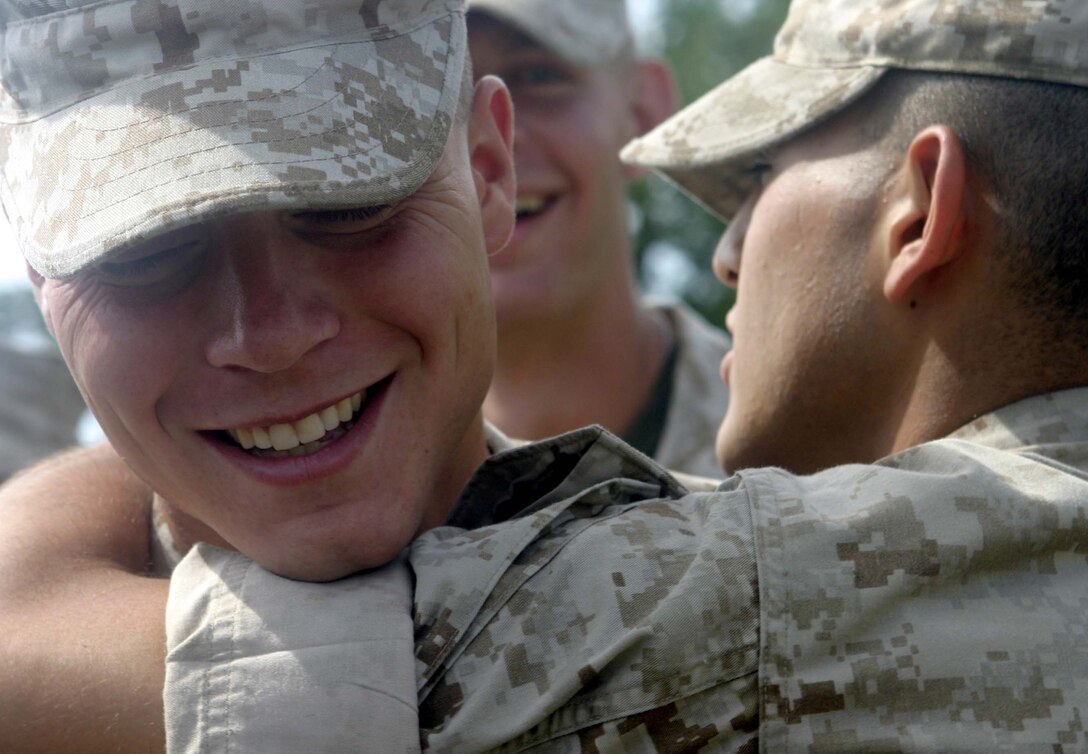 Petty Officer 3rd Class Drew P. Barkman receives congratulations from fellow Sailors and Marines of 3rd Battalion, 2nd Marine Regiment after getting promoted to petty officer third class June 23. Barkman joined the battalion November of 2005 and will deploy with his battalion to Iraq next month.