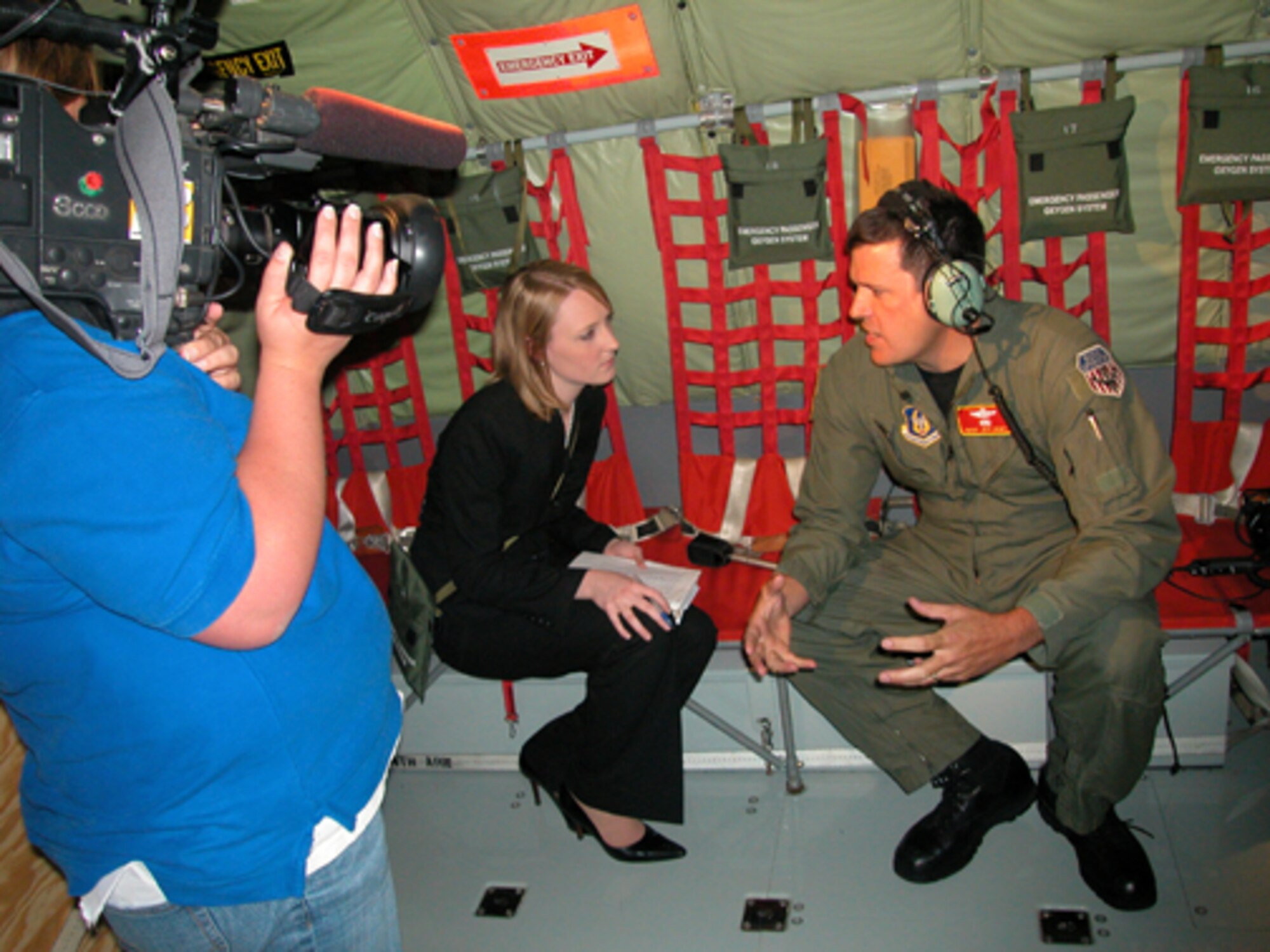 GRISSOM AIR RESERVE BASE, Ind--Senior Master Sgt. Jeff Henry, a boom operator with the 434th Air Refueling Wing, is interviewed by Emily Parker, a reporter for WLFI-TV 18 from Lafayette, Ind., during a recent media orientation flight. Eight members of the Indiana media community visited Grissom and participated in a refueling mission to learn and tell the Grissom story.  (U.S. Air Force photo/Tech. Sgt. Doug Hays)