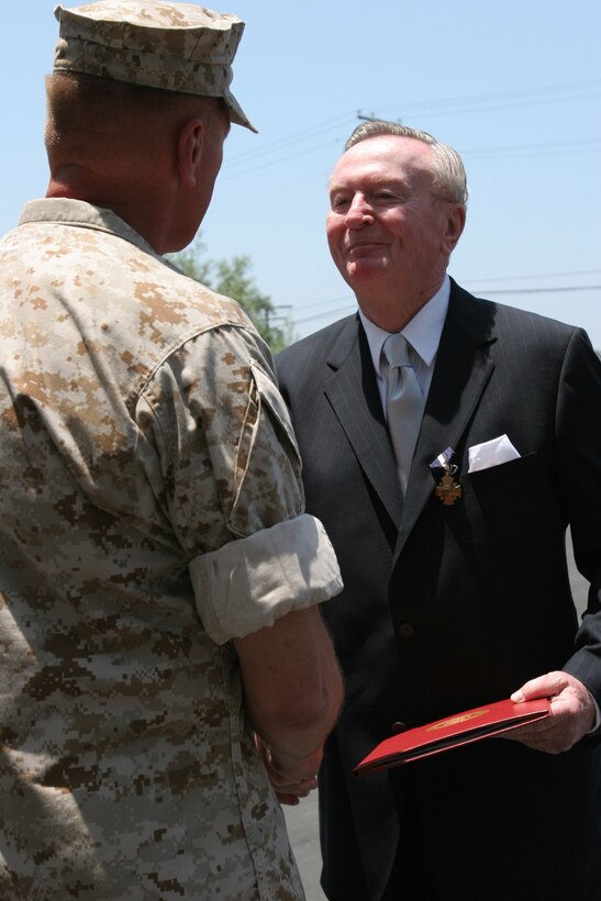 Retired Col. Joseph J. O?Brien shakes the hand of Major Gen. Richard F. Natonski, the Commanding General of Camp Pendleton?s 1st Marine Division, after receiving The Navy Cross for heroic actions during Vietnam.