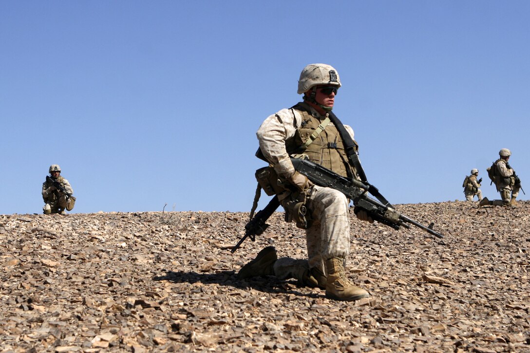 AL QATRANAH, Jordan, (Aug. 16, 2008) -- Marines with Fox Company, Battalion Landing Team 2/5, 15th Marine Expeditionary Unit, take a knee during a tactical patrol, part of the bi-lateral training exercise "Infinite Moonlight" in the Jordanian desert.::r::::n::   Infinite Moonlight, a two-week exercise conducted by the U.S. military and the Jordanian Army, is designed to share tactical knowledge and build on the military ties between the United States and Jordan.::r::::n::   The Camp Pendleton, Calif. based 15th MEU is comprised of approximately 2,200 Marines and Sailors and is a forward deployed force of readiness capable of conducting numerous operations, such as Non-Combatant Evacuation Operations, Humanitarian Assistance Operations and a wide range of amphibious missions. ::r::::n::   The 15th MEU is currently conducting sustainment training in the desert of Jordan. (Official USMC photo by Cpl. Timothy T. Parish) (Released)::r::::n::