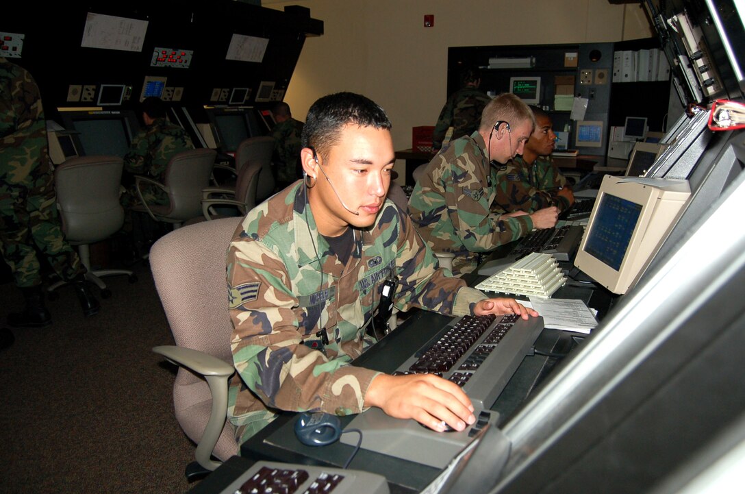 Senior Airman Anthony Michels monitors flights at the radar approach control facility at Laughlin Air Force Base, Texas, on June 26, 2006. Airman Michaels, from Rosemont Minn., is an air traffic controller with the 47th Operations Support Squadron. (U.S. Air Force photo/Staff Sgt. Jeremy Larlee)