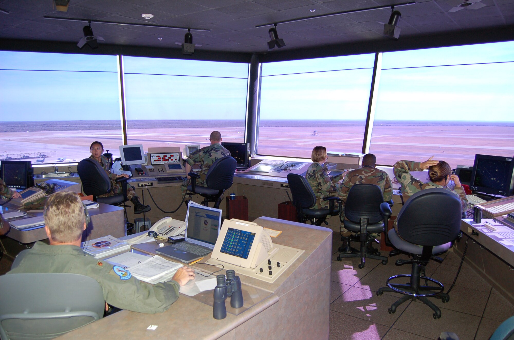 Air traffic controllers monitor traffic on the flightline at Laughlin Air Force Base, Texas, on June 26, 2006. During the morning peak time an aircraft takes off every three minutes from one of the base's three runways. (U.S. Air Force photo/Staff Sgt. Jeremy Larlee)