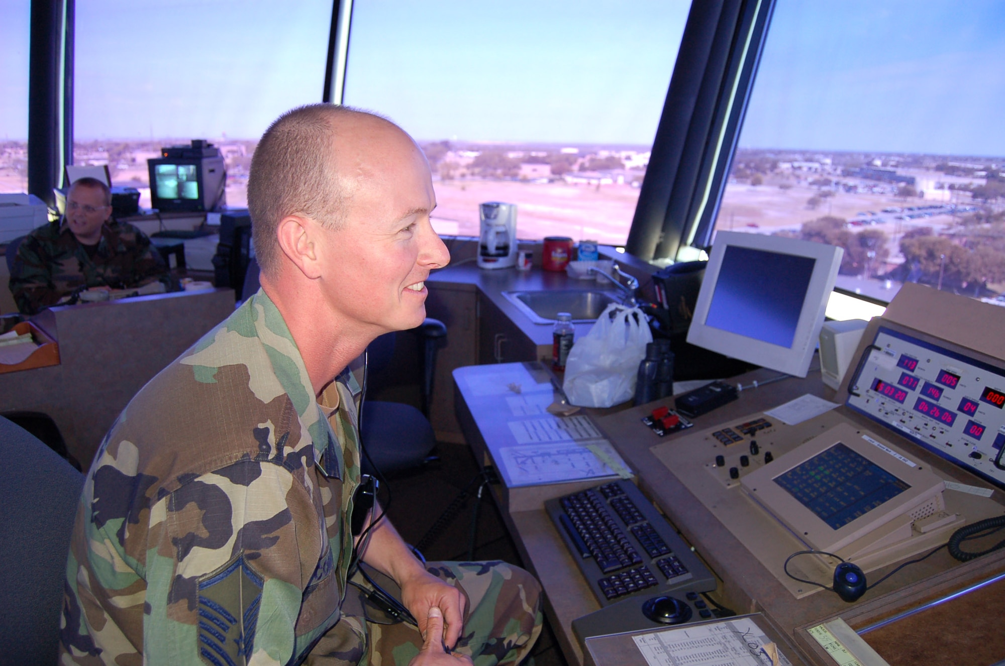 Master Sgt. Daniel Comer monitors flightline activity from the air traffic control tower at Laughlin Air Force Base, Texas, on June 26, 2006. Sergeant Comer, from Hallstead, Pa., is an air traffic controller with the 47th Operations Support Squadron. (U.S. Air Force photo/Staff Sgt. Jeremy Larlee)