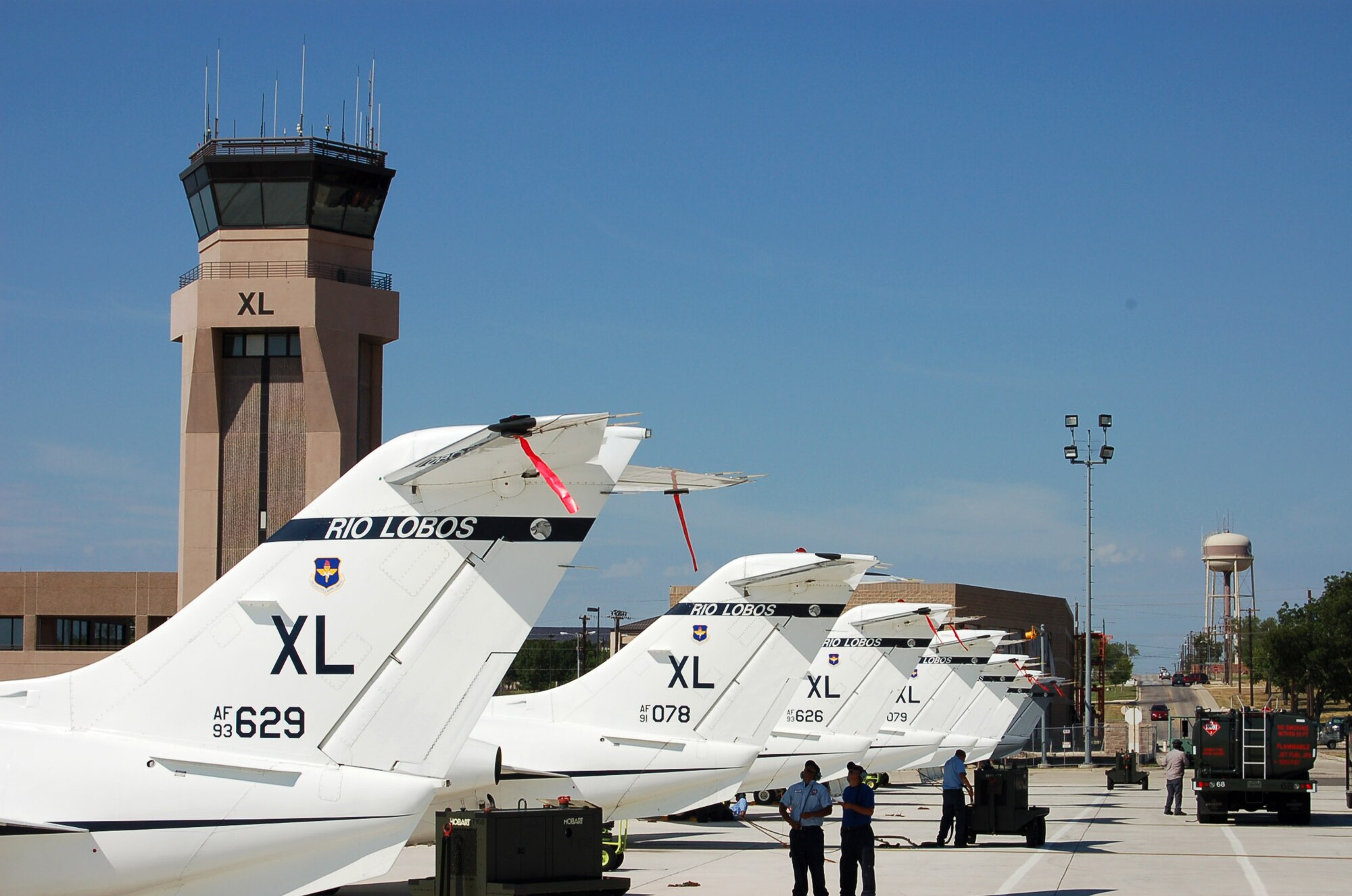 T-1 Jayhawks are parked on the ramp in front of the air traffic control tower at Laughlin Air Force Base, Texas, on June 26, 2006. Laughlin's 47th Flying Training Wing trains Air Force pilots, who fly about 89,000 flying hours a year. (U.S. Air Force photo/Staff Sgt. Jeremy Larlee)