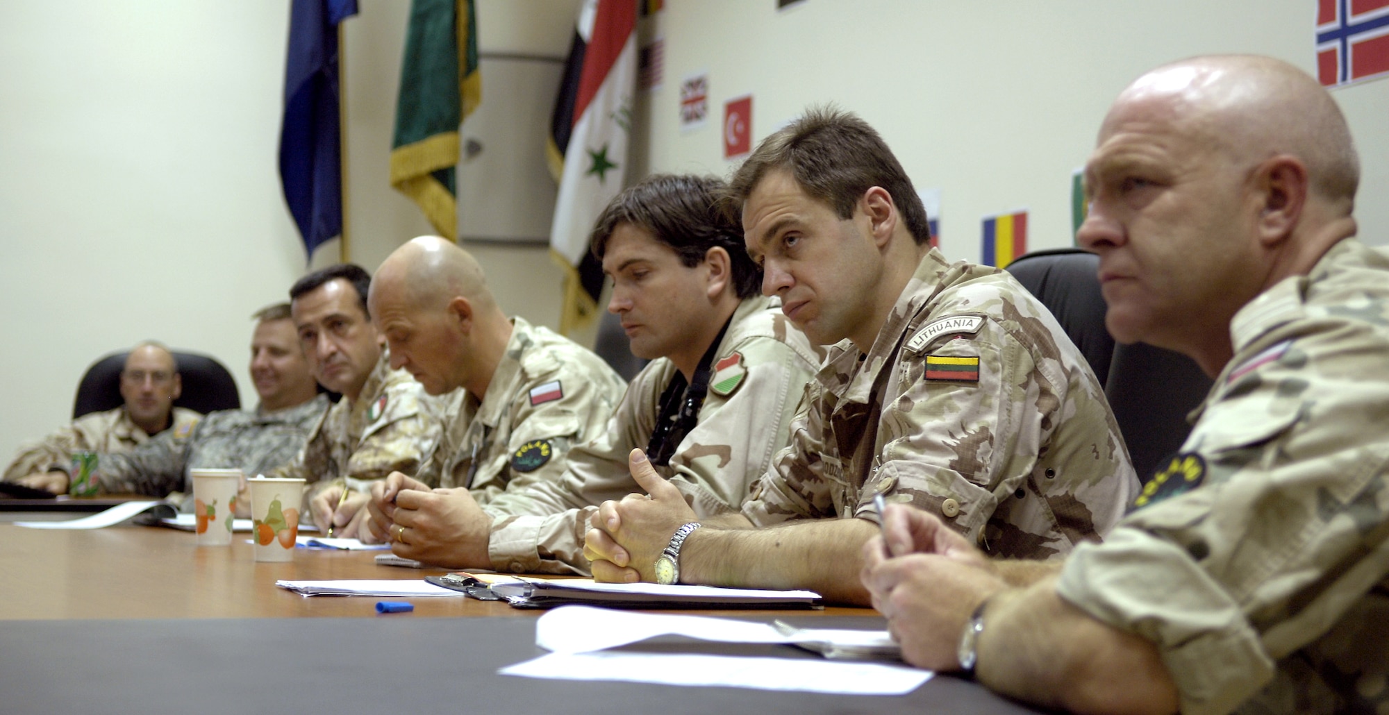 Representatives from NATO forces discuss security operations during a meeting at Camp Rustamiyah, Iraq, on Saturday, June 24. (U.S. Air Force photo/Senior Airman Brian Ferguson)

