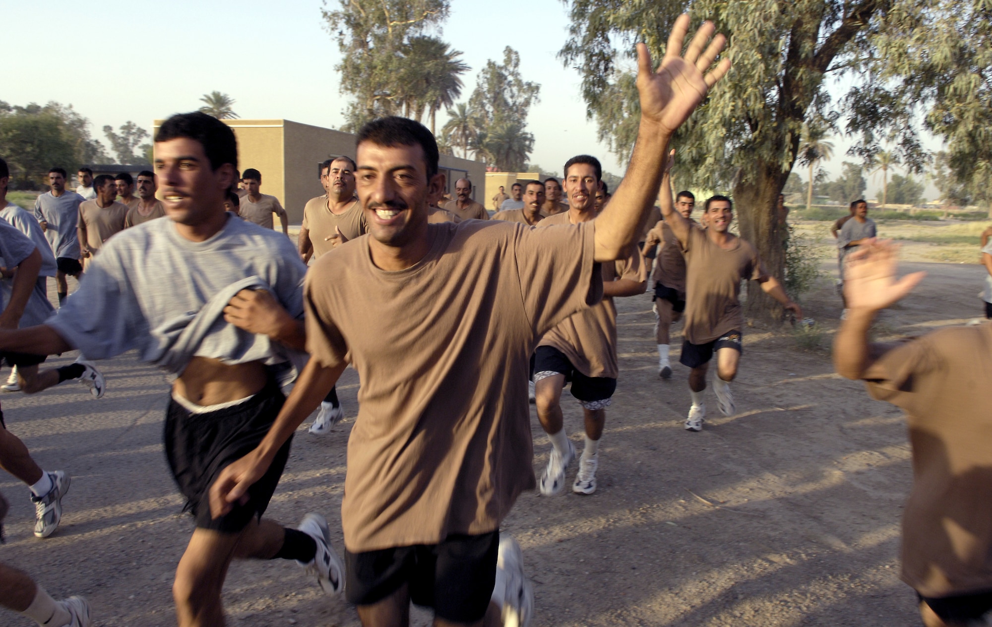 Iraqi soldiers participate in physical training at Camp Rustamiyah, Iraq, on Thursday June 22. The soldiers are with the base defense battalion preparing to take over security for the camp, which houses NATO forces and the Iraqi Military Academy. (U.S. Air Force photo/Senior Airman Brian Ferguson)

