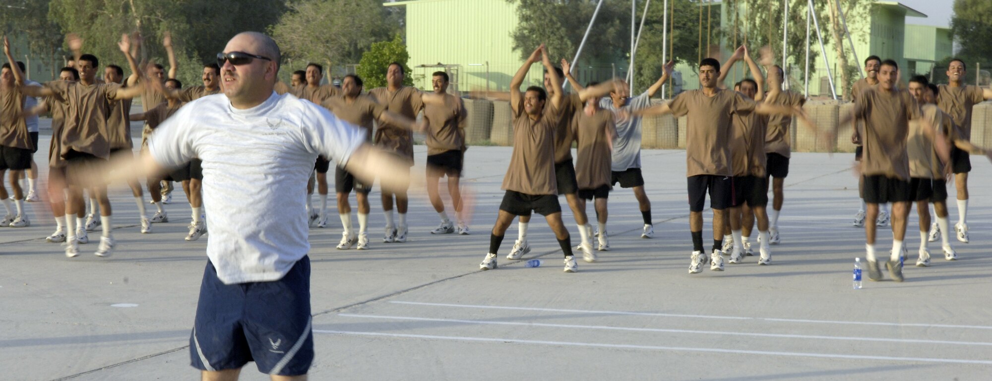 Master Sgt. James Trefurt leads Iraqi soldiers in physical training at Camp Rustamiyah, Iraq, on Thursday, June 22. The soldiers are with the base defense battalion preparing to take over security for the camp, which houses NATO forces and the Iraqi Military Academy. Sergeant Trefurt is the NCO in charge of operations for the Coalition Military Assistance Training Team. (U.S. Air Force photo/Senior Airman Brian Ferguson)