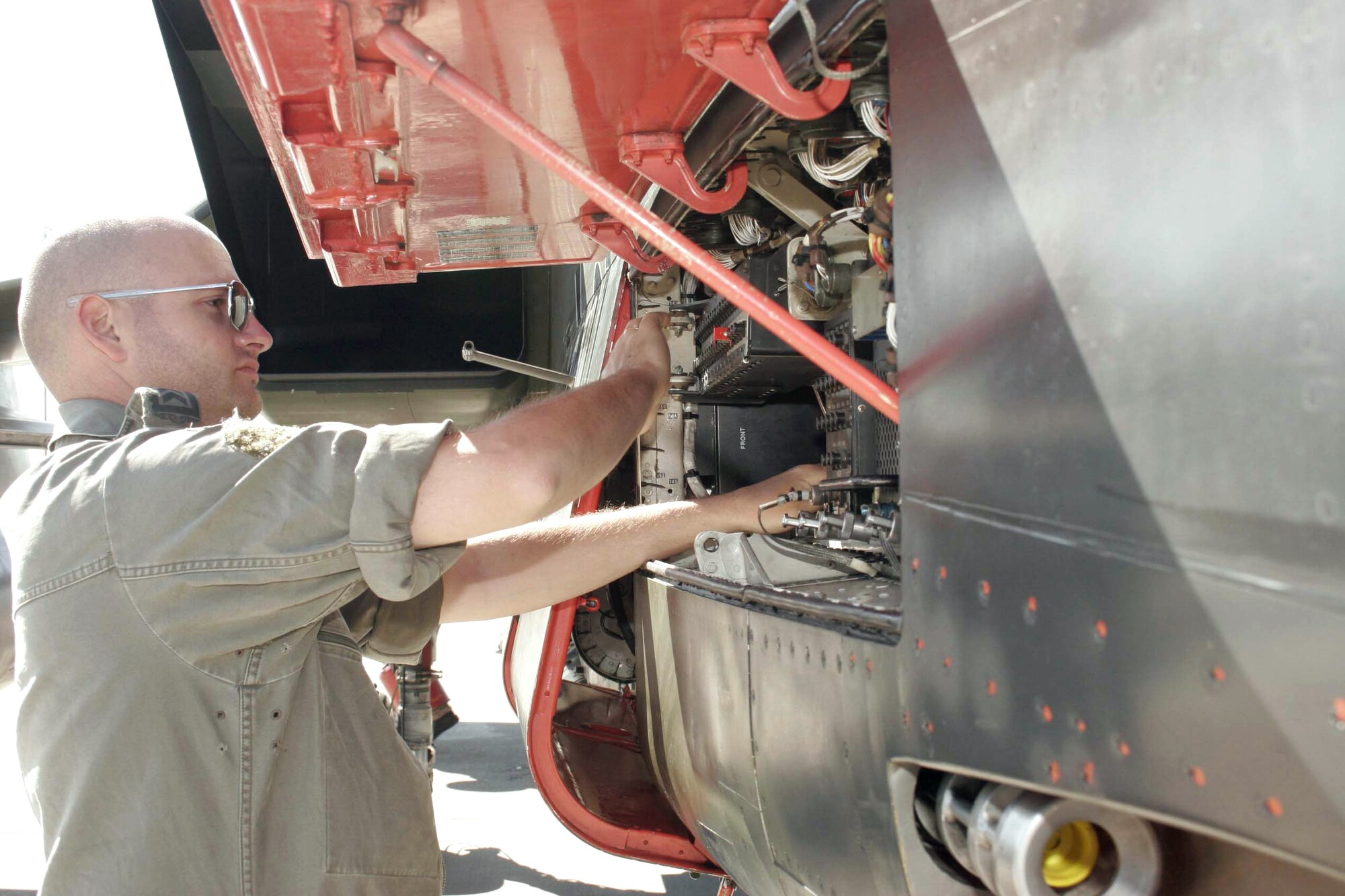 Tech. Sgt. Kalle Leichenwascher performs maintenance on a Tornado interdiction strike aircraft before a flight at Mountain Home Air Force Base, Idaho, on Wednesday, June 21. German air force aircrews and maintenance teams are working alongside their American counterparts during a joint training exercise. Sergeant Leichenwascher is a crew chief with the German air force. (U.S. Air Force photo/Master Sgt. Brian S. Orban) 
