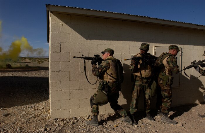 Students of the Ground Combat Training School practice assaulting a building during an intensive desert warfare training course on the Nevada Test and Training Range. More than 4,000  security forces Airmen attend the course each year. (U.S. Air Force photo)