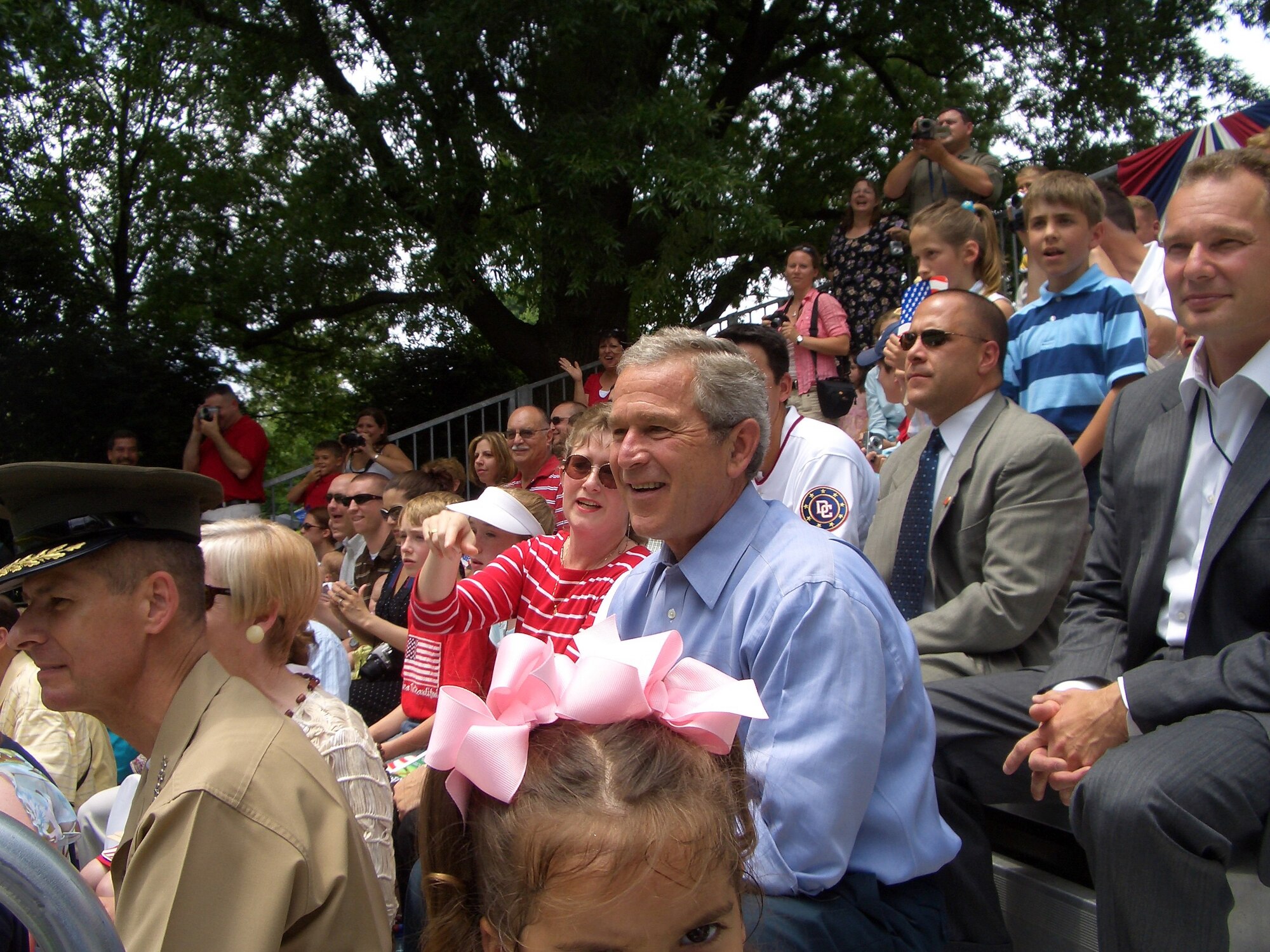 President George W. Bush and Barbara Martin, wife of Col. Rick Martin, 305th Air Mobility Wing commander (left of the president), watch the McGuire Yankees and Dolcom Indians Little League tee ball game on the White House South Lawn June 23.

Photo by:  Senior Airman Dilia DeGrego