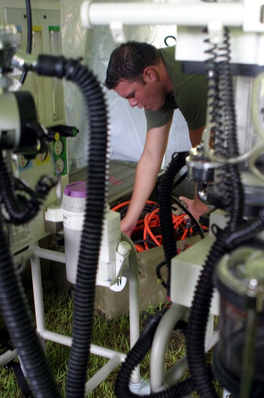 MARINE CORPS BASE CAMP LEJEUNE, N.C. (June 27, 2006) ?  Petty Officer 3rd Class Daniel S. McCoy gathers some supplies to set up a surgical shock trauma platoon setup. The particular SSTP the sailors of Bravo Surgical were setting up included a stabilization tent, operating room, holding facility and an ancillary services lab designed to treat patients off the front lines. McCoy is a surgical technician with Bravo Surgical Co., 2nd Medical Battalion, 2nd Marine Logistics Group.