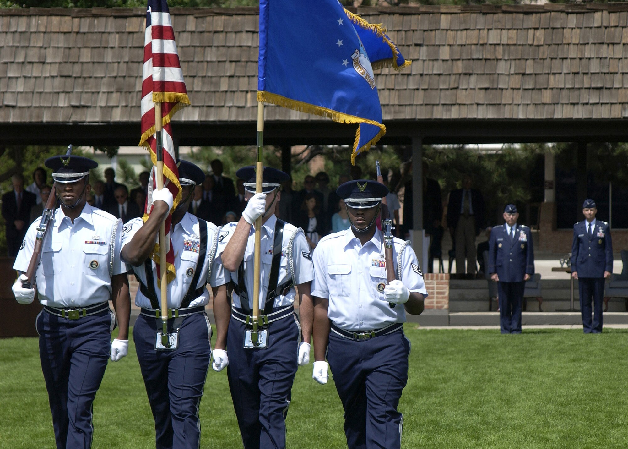 Air Force Chief of Staff Gen. T. Michael Moseley and Gen. Kevin P. Chilton, commander of Air Force Space Command, await the posting of the colors by the High Frontier Honor Guard during the AFSPC assumption of command ceremony on Monday, June 26, at Peterson Air Force Base, Colo. (U.S. Air Force photo/Duncan Wood) 
