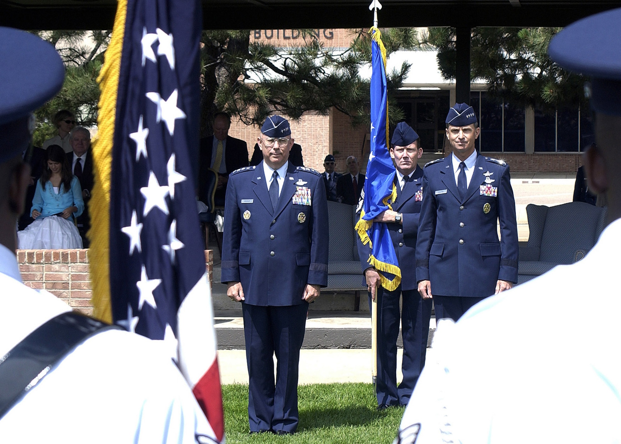 Gen. Kevin P. Chilton (right) became the 13th commander of Air Force Space Command in a ceremony at Peterson Air Force Base, Colo., on Monday, June 26. Air Force Chief of Staff Gen. T. Michael Moseley presided over the ceremony. Chief Master Sgt. Ron Kriete, AFSPC's command chief, stands ready to present the flag. (U.S. Air Force photo/Duncan Wood)