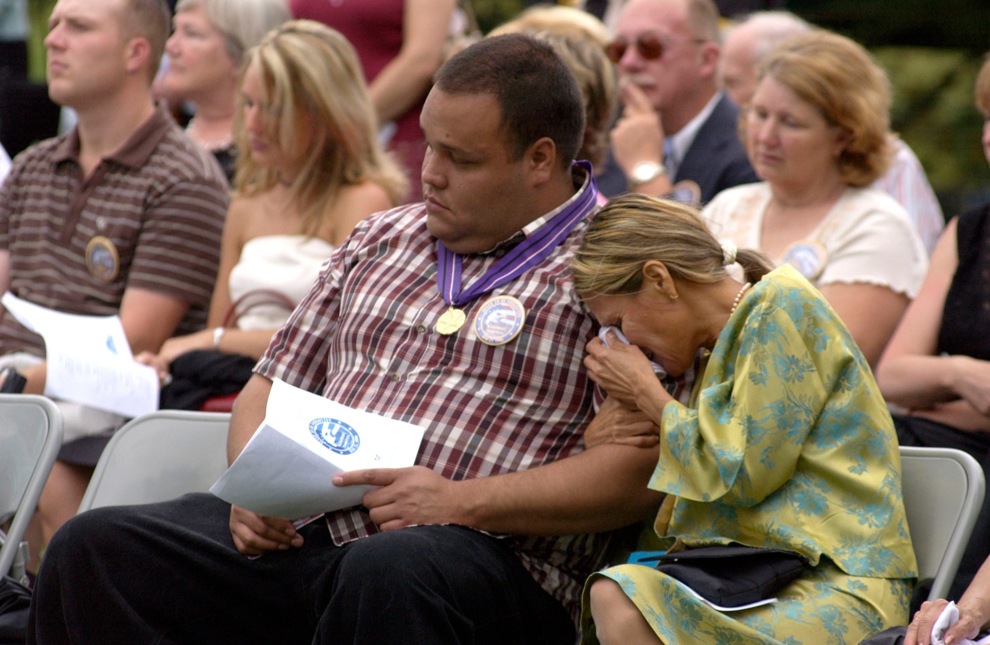 Jenny Haun is comforted by her son, Rafael Haun, during the 10th anniversary remembrance ceremony of the Khobar Towers bombing on Sunday, June 25, at Arlington National Cemetery, Va.  Her husband, Capt. Leeland Haun, was one of 19 Airmen killed in the terrorist bombing at Dhahran Air Base, Saudi Arabia, on June 25, 1996. Family members and friends of those lost gathered for the remembrance ceremony.   (U.S. Air Force photo/Tech. Sgt. Cohen A. Young) 