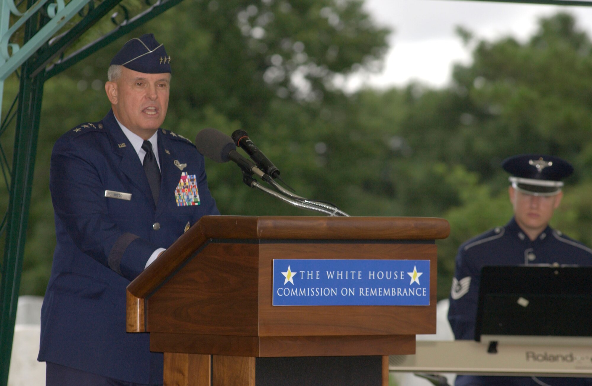 Lt. Gen. Stephen G. Wood speaks at the 10th anniversary remembrance of the Khobar Towers bombing on Sunday, June 25, at Arlington National Cemetery, Va. Nineteen Airmen were killed in the terrorist bombing at Dhahran Air Base, Saudi Arabia. General Wood is deputy chief of staff for strategic plans and programs at headquarters Air Force.  (U.S. Air Force photo/Tech. Sgt. Cohen A. Young)