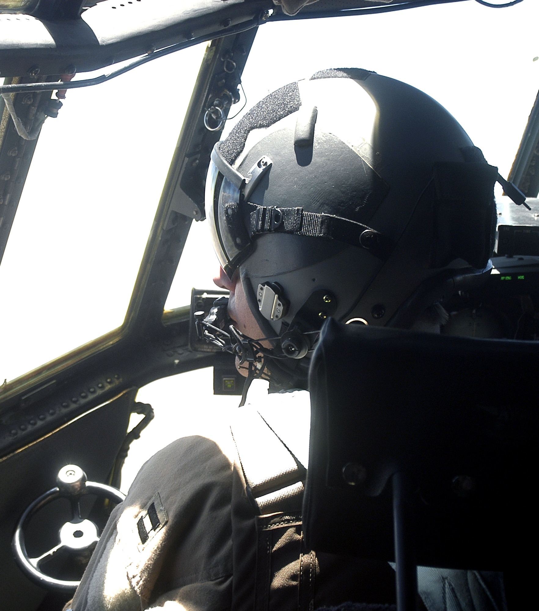 Capt. Andrew Sides scans for another aircraft while flying a C-130 Hercules on a combat mission over Afghanistan in support of Operation Enduring Freedom on Monday, June 19. Captain Sides is a pilot deployed to the 774th Expeditionary Airlift Squadron at Bagram Air Base, Afghanistan, from the Delaware Air National Guard. (U.S. Air Force photo/Maj. David Kurle)