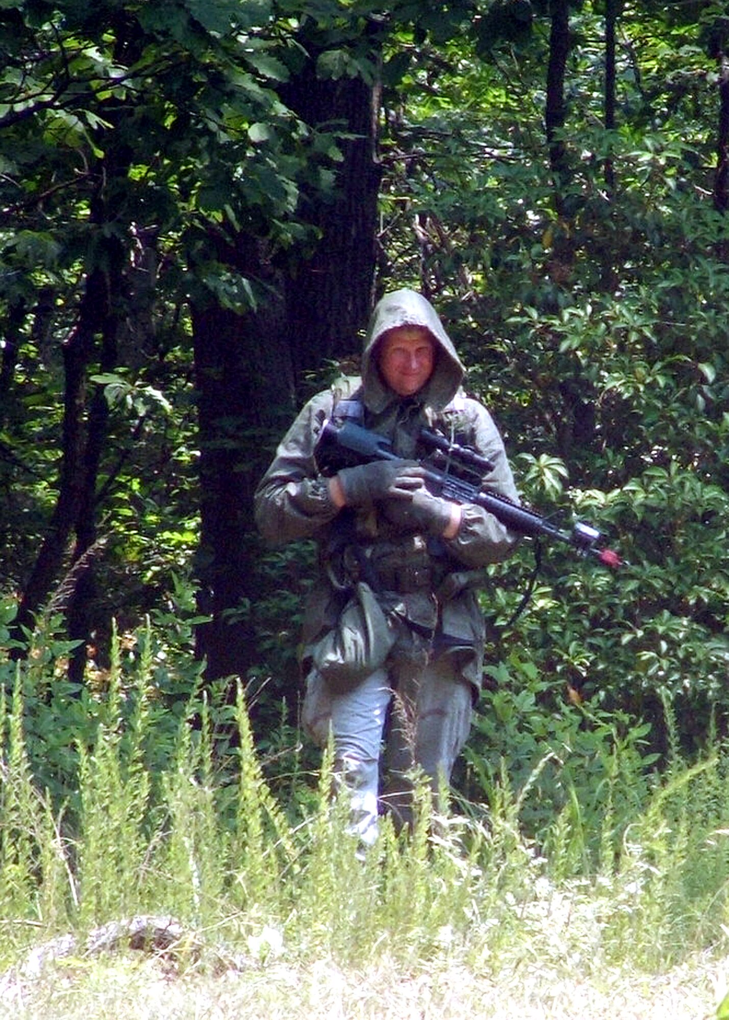 Tech. Sgt. Brandon Cooper plays the role of an opposing forces member during the Integrated Contingency Skills Training Course 06-4 convoy training at Fort Dix, N.J., on Thursday, June 22. More than 165 students are participating in the course. Students also learn urban tactics in preparation for deployments. The training is taught by staff at the Air Mobility Warfare Center's 421st Combat Training Squadron. (U.S. Air Force photo/Tech. Sgt. Scott T. Sturkol)
