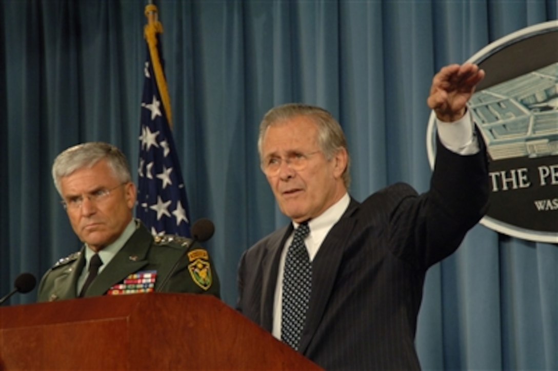 Defense Secretary Donald H. Rumsfeld, right, and U.S. Army Gen. George W. Casey Jr., commanding general, Multi-National Force - Iraq, respond to questions during a Pentagon press briefing on the progress of the war on terror and other operational updates June 22, 2006.