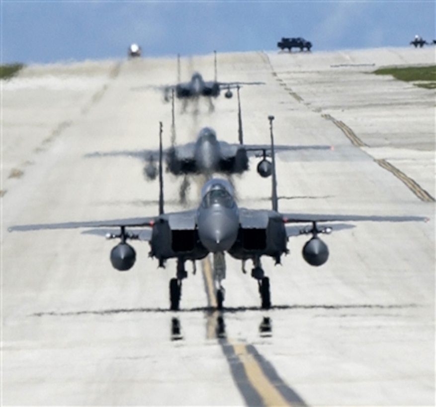 U.S. Air Force F-15E Strike Eagles taxi at Andersen Air Force Base, Guam, after a training sortie, June 5, 2006. The Strike Eagles are here through September as part of an air expeditionary deployment.