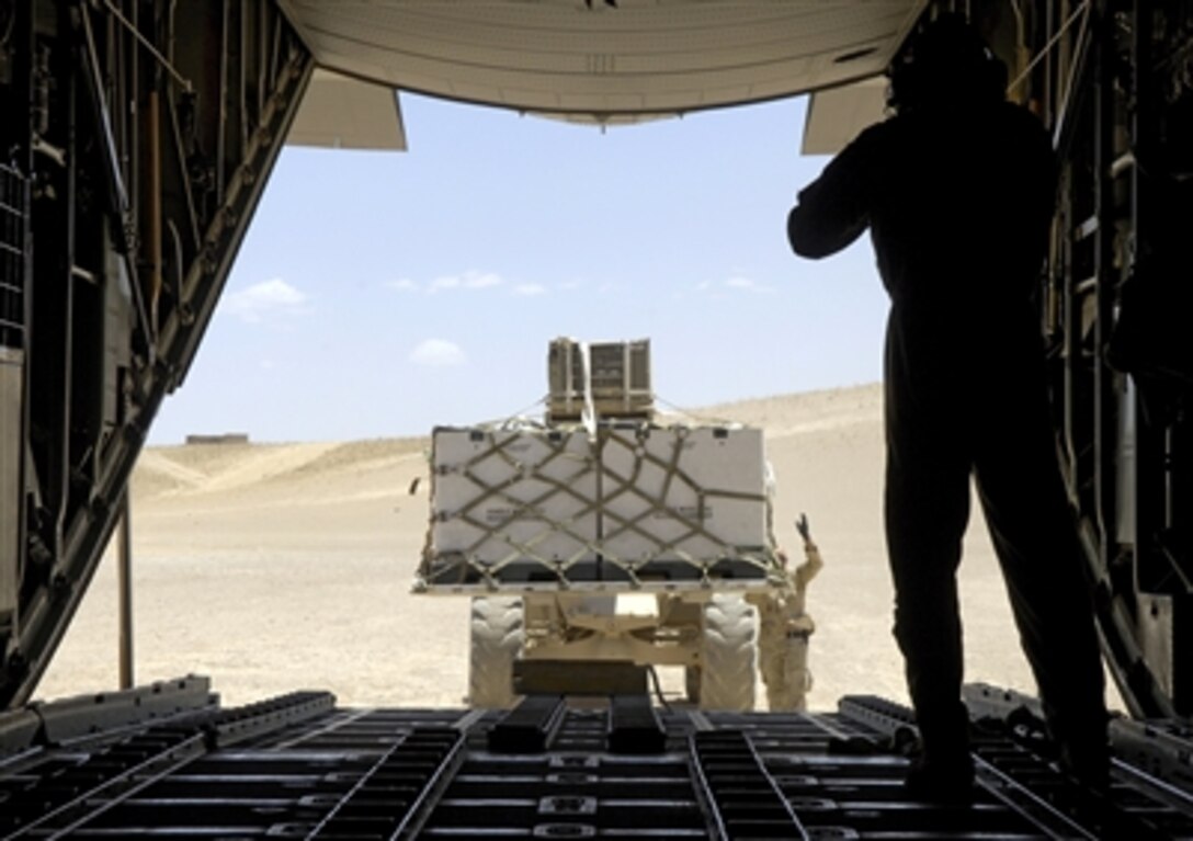 On a dirt runway in Tarin Kowt, Afghanistan, a forklift loads a C-130H2 Hercules with cargo, June 14, 2006. The Hercules is part of the 774th Expeditionary Airlift Squadron and is the only U.S. C-130 squadron in Afghanistan. The squadron flies four to five missions a day providing airlift and air drops to troops in theater.