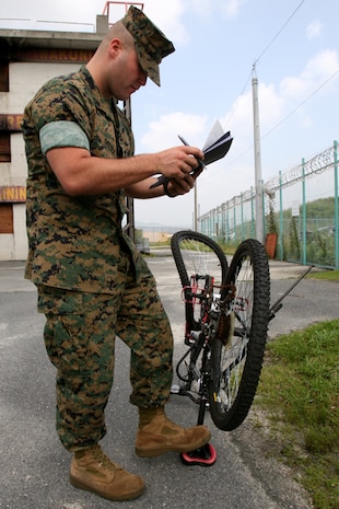 Cpl. Michael A. Orozco, Provost Marshal?s Office community resource center, inventories an unregistered bicycle during a bicycle roundup here, June 27.
