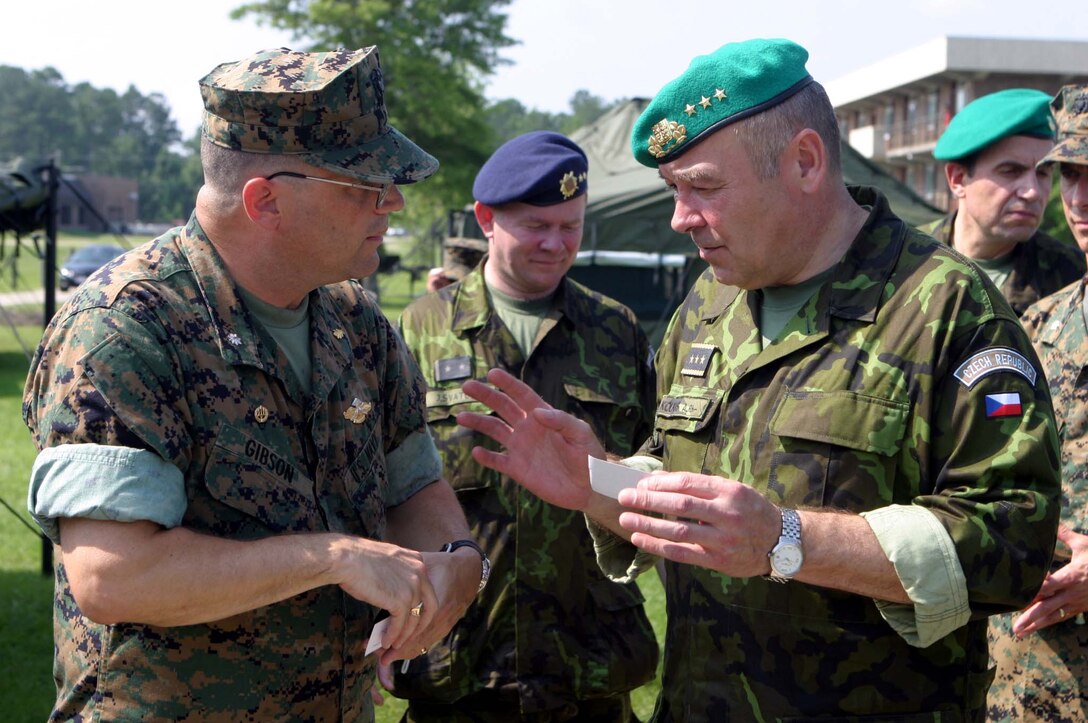 MARINE CORPS BASE CAMP LEJEUNE, N.C. (June 28, 2006) ? Commander Dave E. Gibson (left) exchanges contact information with Czech Lt. Gen. Jaroslav Kolkus, June 28. Kolkus and staff visited to exchange ideas and concepts involving the medical logistics side of the Fleet Marine Force. Gibson is the commanding officer of 2nd Medical Bn. and Kolkus is the 1st Deputy Chief of General Staff of the Czech Republic.