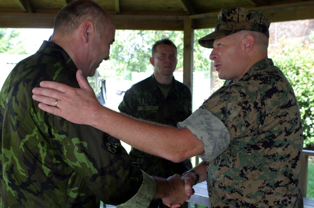 MARINE CORPS BASE CAMP LEJEUNE, N.C. (June 28, 2006) ?Czech Lt. Gen. Jaroslav Kolkus and Brigadier Gen. James A. Kessler exchange handshakes, June 28. Kolkus visited to share ideas with the Marines and sailors of 2nd Medical Battalion, 2nd Marine Logistics Group and 2nd Light Armored Reconnaissance Bn., 2nd  Marine Division. Kessler is the commanding general of 2nd MLG and Kolkus is the 1st Deputy Chief of General Staff of the Czech Republic.
