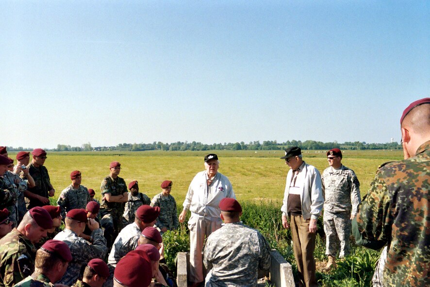 Two of the paratroopers from the D-Day invasion on June 6, 1944, talk to 150 paratroopers from the U.S., France, Britain, Canada and Germany about their experience 62 years earlier in Normandy, France. The younger paratroopers were participating in the 62nd anniversary observance of the D-Day invasion. (U.S. Air Force photo/Master Sgt. Andrew Johnson)