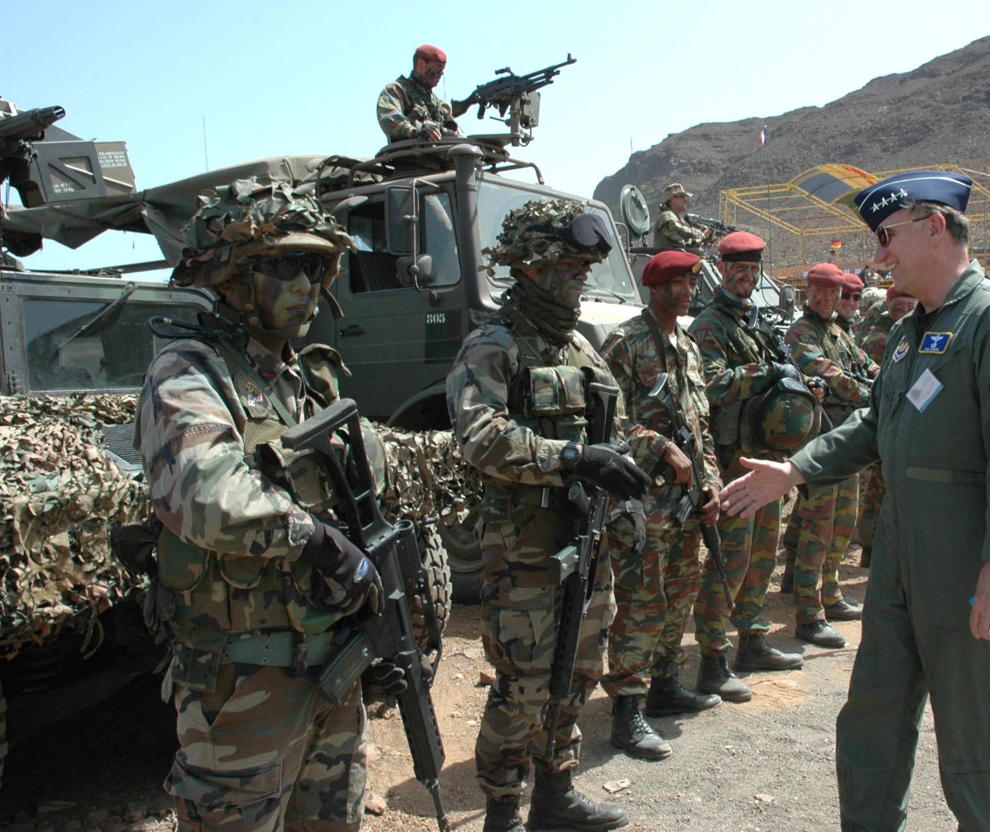 Gen. William T. Hobbins congratulates NATO troops at Exercise Steadfast Jaguar in Sao Vicente, Cape Verde, on Friday, June 23. The purpose of the live exercise is to test NATO Response Force-7's ability to project a force a strategic distance from mainland Europe and sustain it. More than 7,000 NATO personnel from land, maritime and air components trained together as a multinational joint force for the exercise that began June 15 and concludes today. General Hobbins is the commander of U.S. Air Forces Europe, and Air Component Command Ramstein, as well as director of the Joint Air Power Competency Center at Ramstein Air Base, Germany. (U.S. Air Force photo/Capt. Krista Carlos)